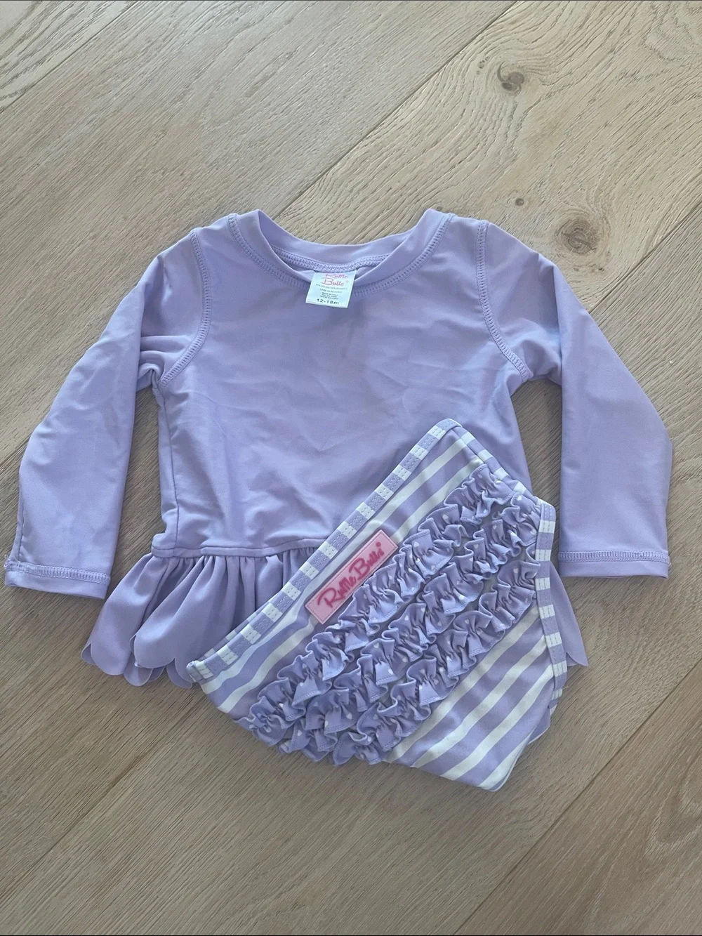 Ruffle Butts Lilac Long-Sleeve Peplum Rash Guard with Striped Bottoms
